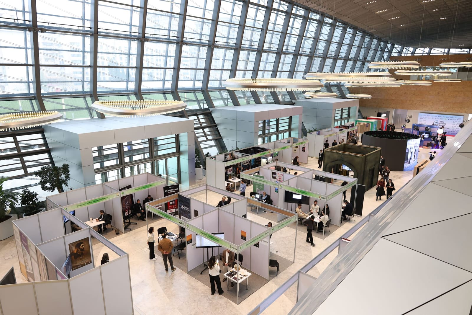 Exhibitor booths and visitors on a trade show floor